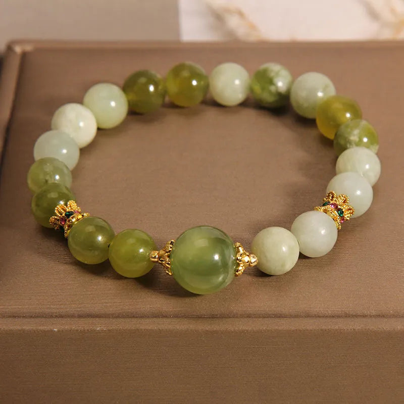 Women's bracelet made of green Xiuyan jade in a light luxury sweet Mori style design.