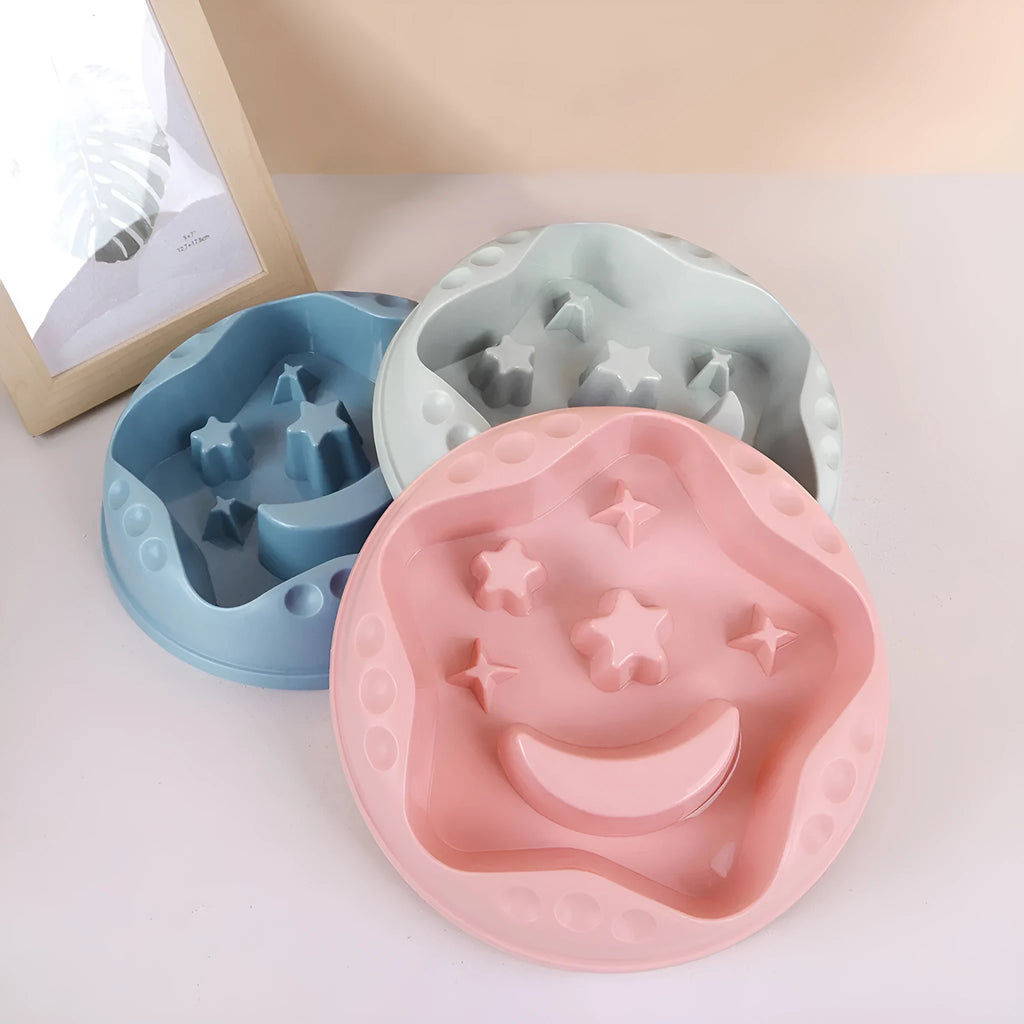 Moon Star Wings ceramic dog slow feeder bowl with raised centre ring and non-slip base in blue, grey, green, pink, or yellow.