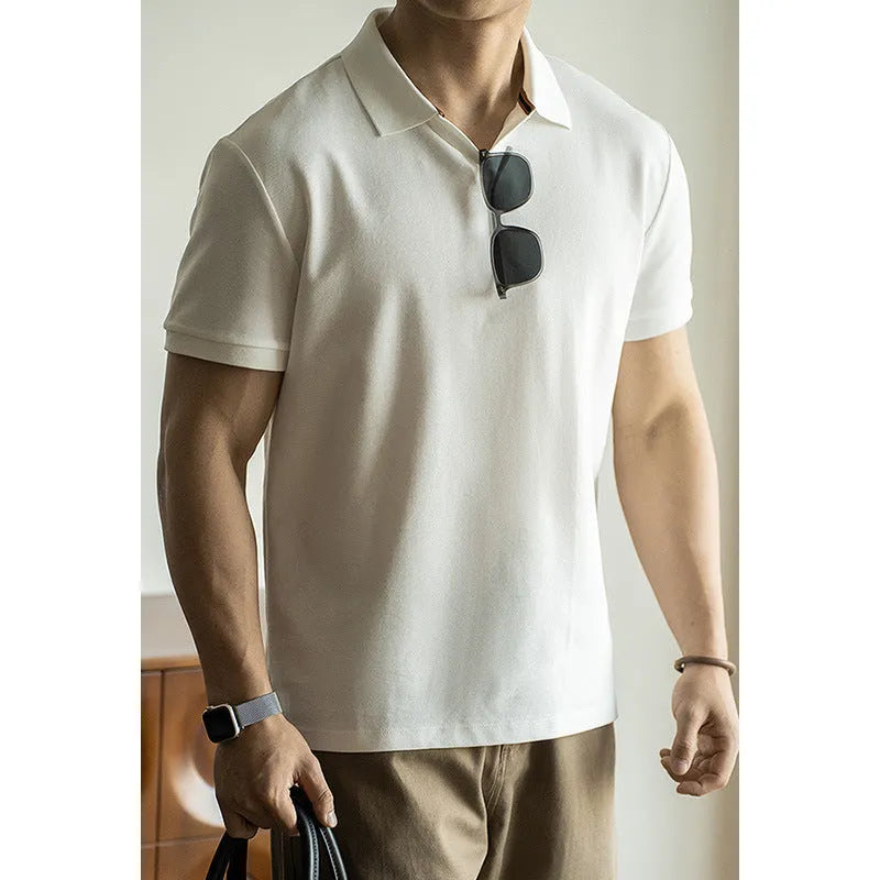 Blue cotton polyester blend short-sleeved polo shirt on a hanger, showing regular fit and casual style.