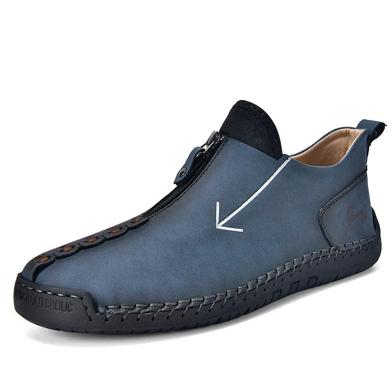 Men's black zip-up Martin boot with round toe and low heel on a white background.