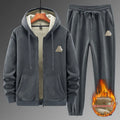 Casual grey sports suit set with a hooded cashmere-feel sweater and matching cotton-look pants on a hanger.