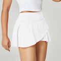 Women's solid colour quick-drying nylon sports shorts on a hanger, shown in light blue.