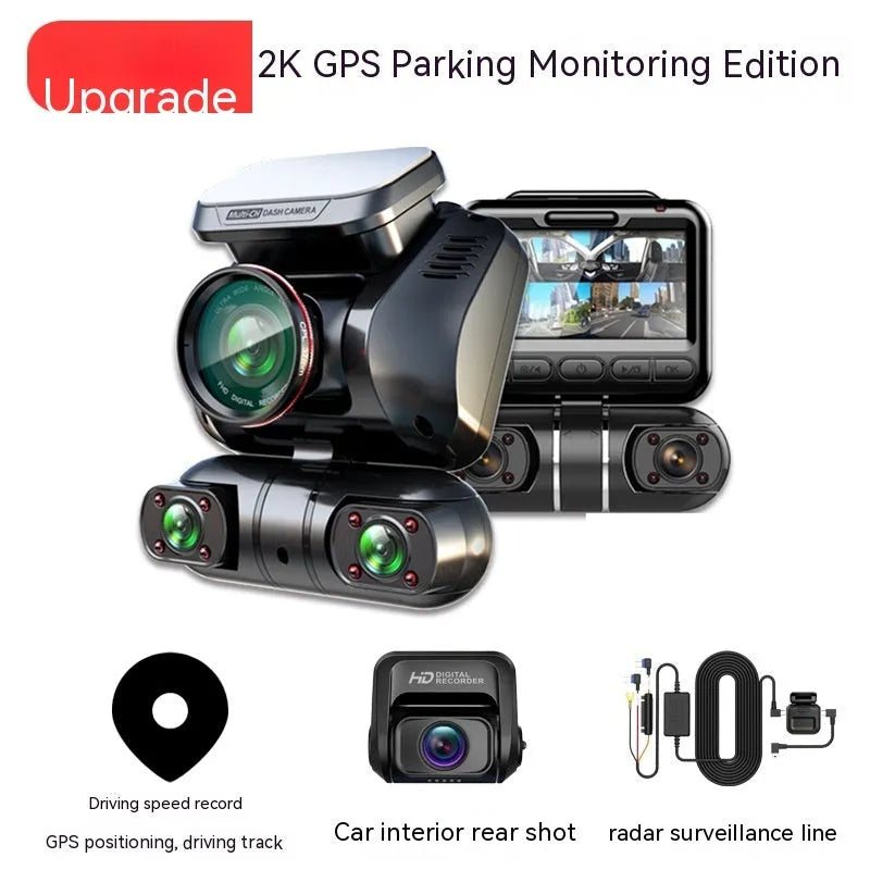 Compact black plastic car dash cam with four lenses and a 2-inch screen for GPS logging and parking surveillance.