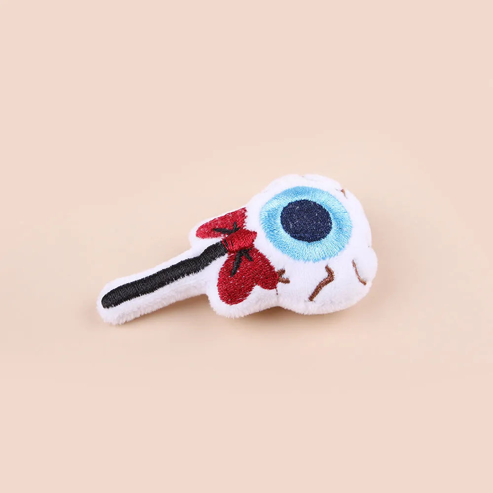 Small plush cat teaser toy with candy and skull designs in eyes or candy colours
