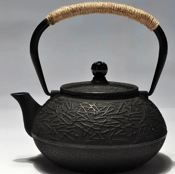 A cast iron teapot with Japanese-style hand-painted decoration, shown in a Bronze finish, with a capacity of 0.9 litres.