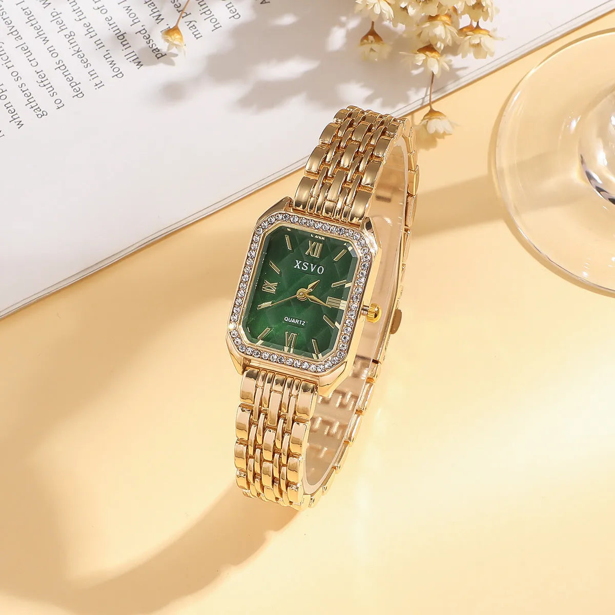 Gold green square women's watch with matching butterfly bracelets on wrist