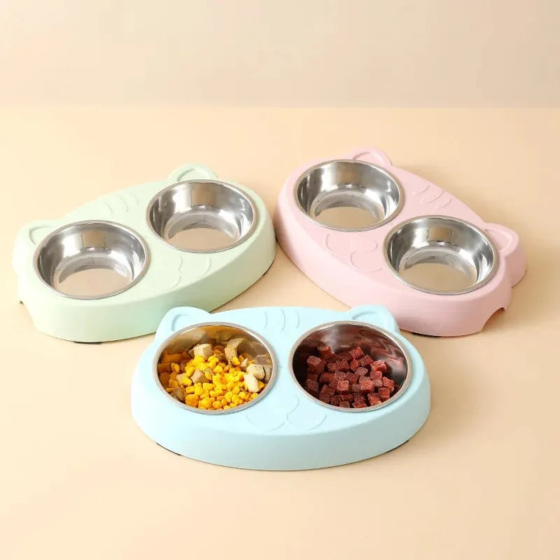 Blue macaron-shaped plastic pet feeding tray with two bowls for cats and small dogs on a white surface