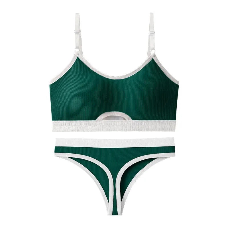 White sports underwear vest with contrast back detail and matching underwear, shown on a hanger.