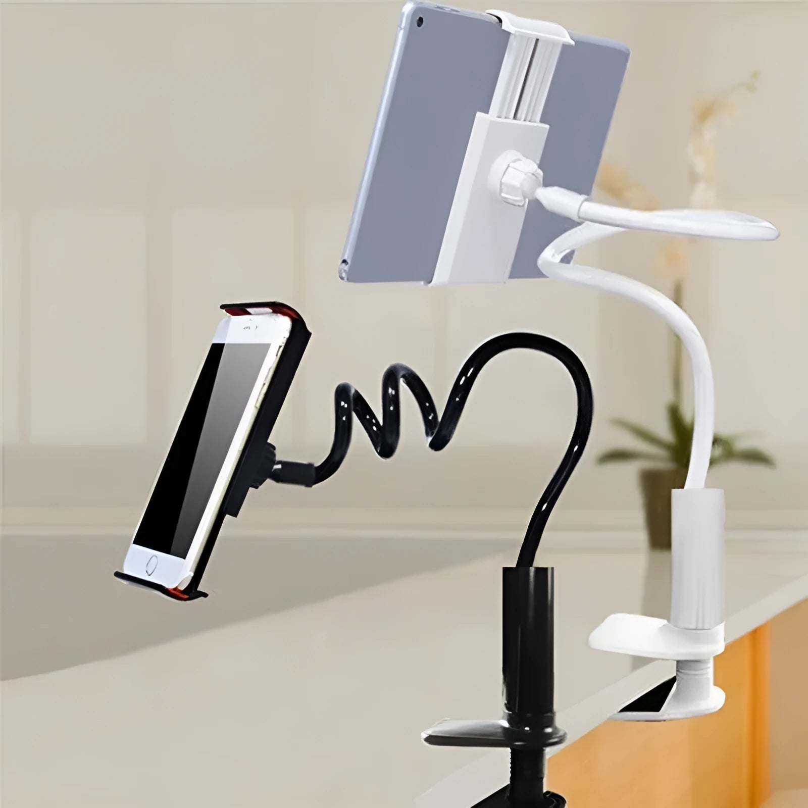 Black flexible gooseneck mount holder with suction base gripping a mobile phone