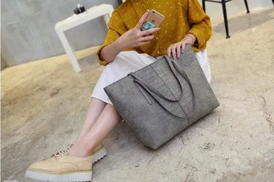 Simple fashion women's shoulder handbag in black or grey colour for spring summer casual outfits