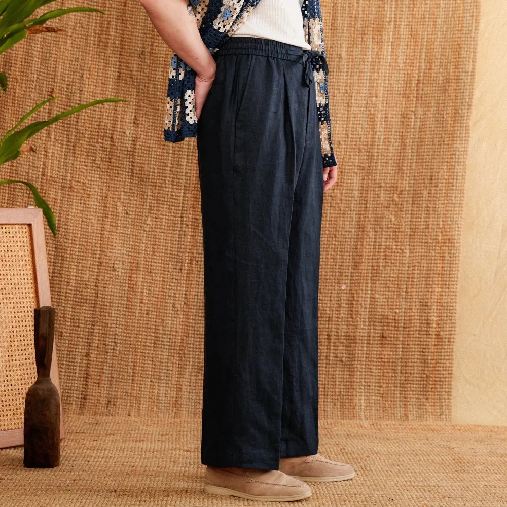 Straight-leg linen trousers with elasticated high waistband in navy blue, white, and greige colours