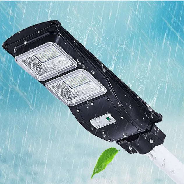 Integrated solar street light unit with solar panel and LED light in one housing