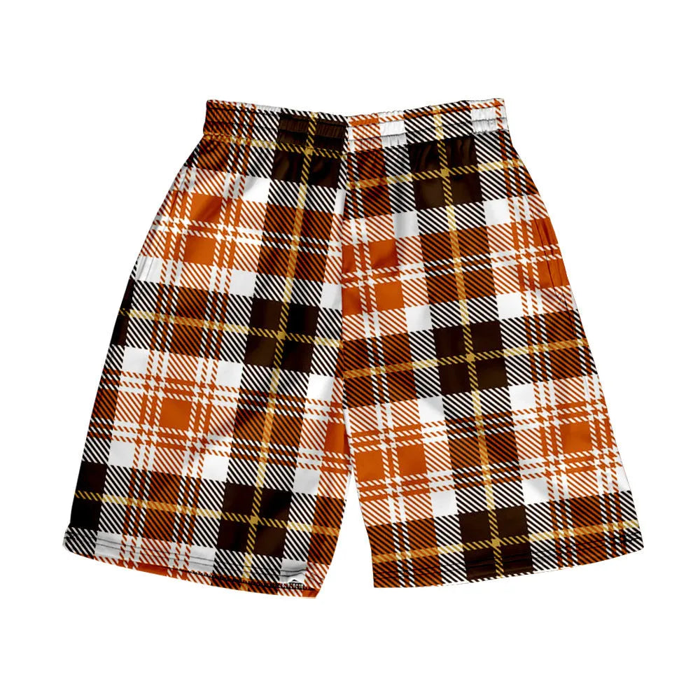 Man wearing plaid patterned polyester shorts with an elastic waistband, showcasing one of the twenty available colour options.