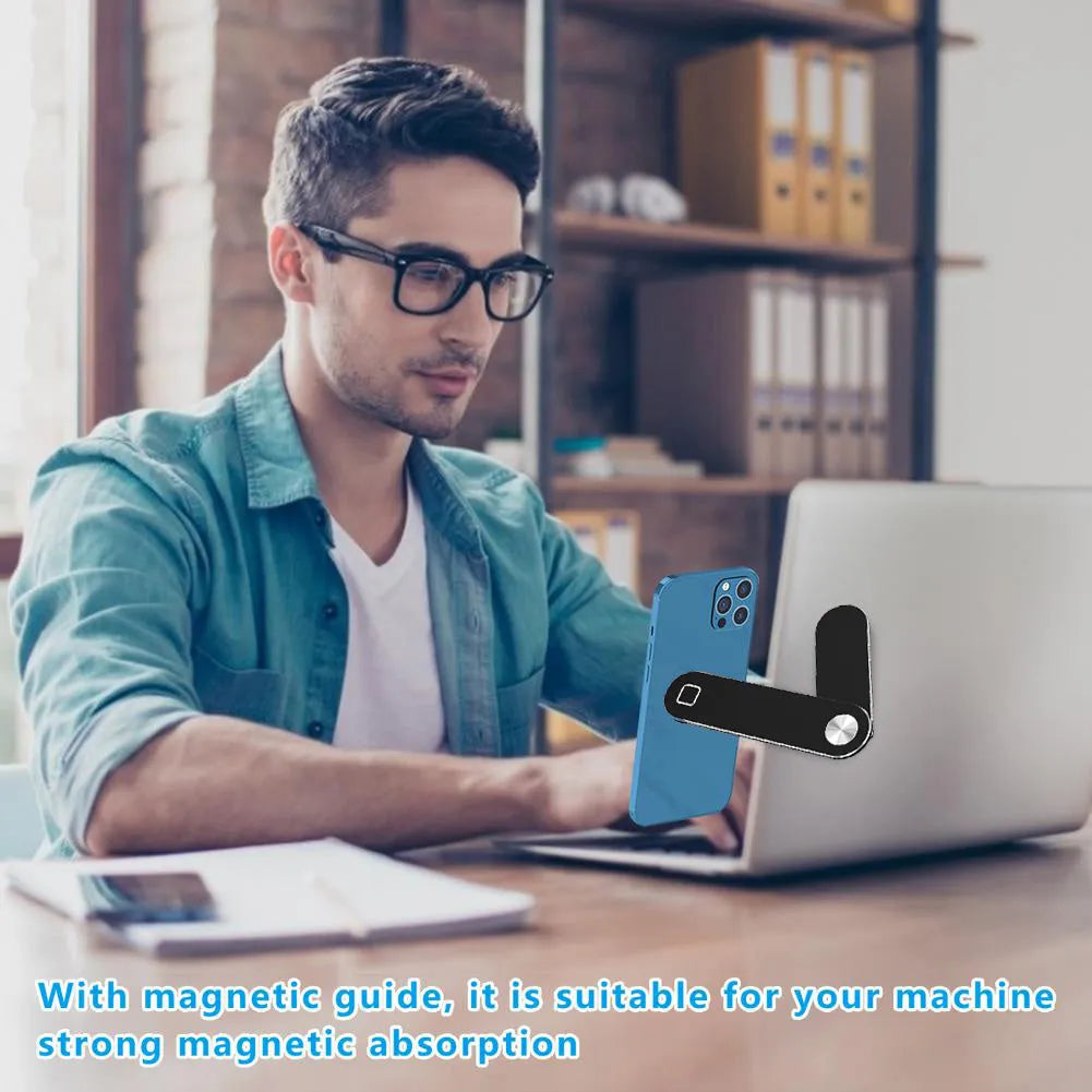 Black magnetic laptop phone holder with adjustable clip mounted on computer monitor