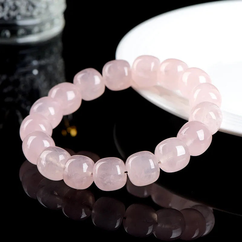 Pink bamboo crystal barrel bead bracelet with 11-12mm geometric beads on wrist