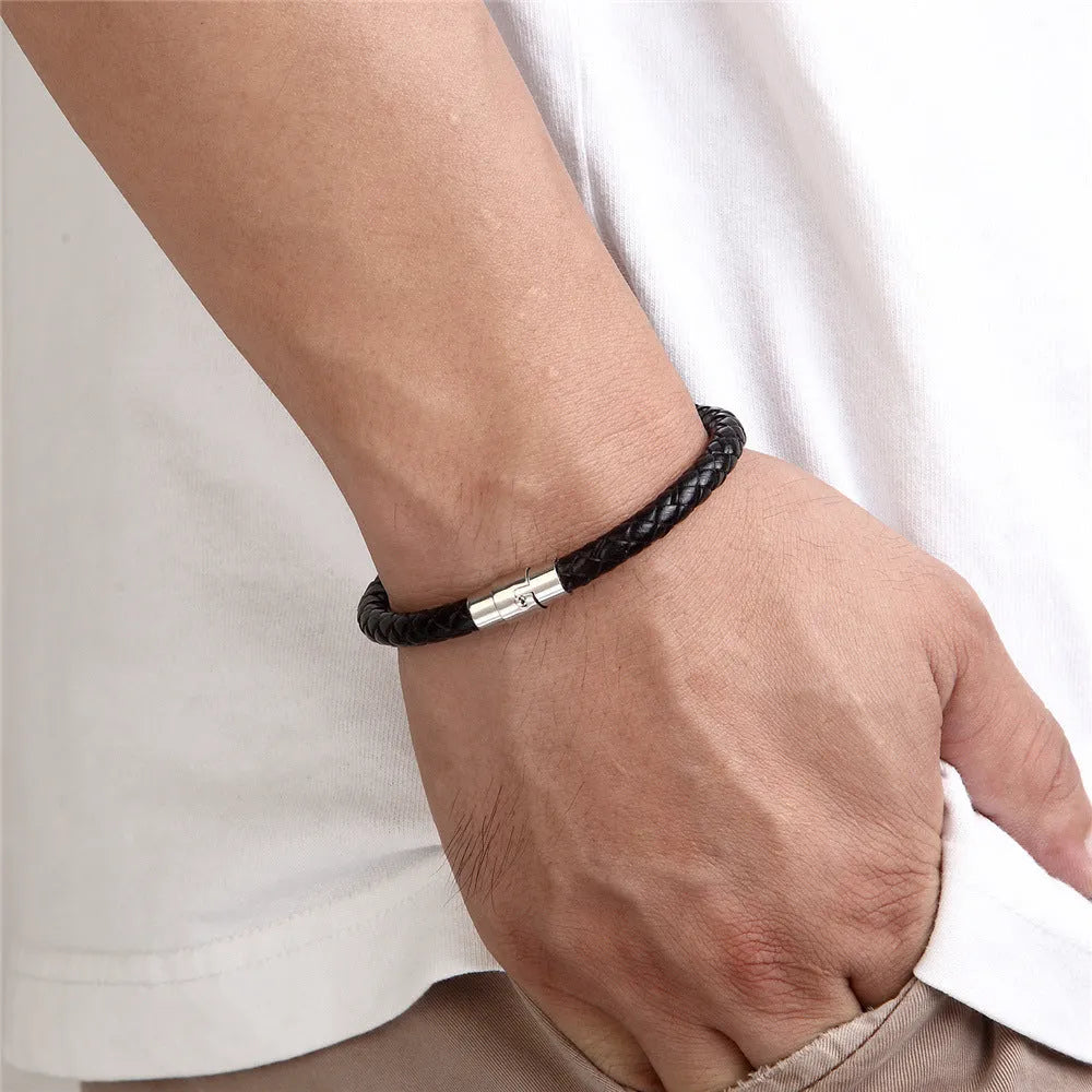 Men's geometric titanium steel wire bracelet with a magnetic clasp shown on a wrist.