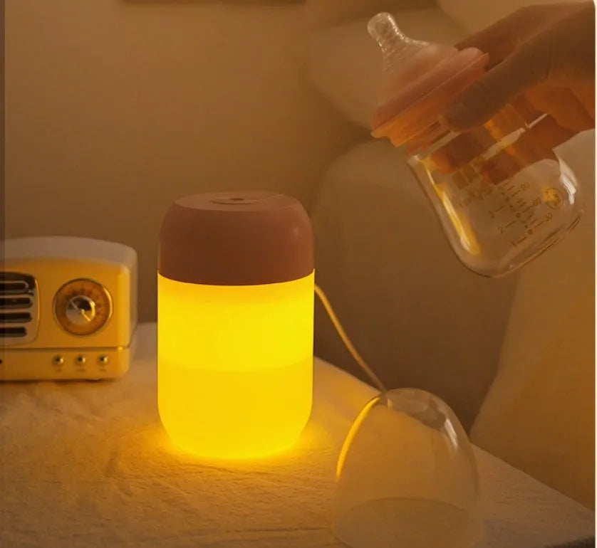 White cylindrical USB-powered mini humidifier with aromatherapy function on wooden desk