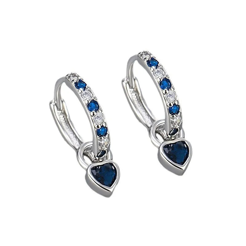 Women's heart-shaped ear clips with a coloured stone, available in gold or white gold colour.