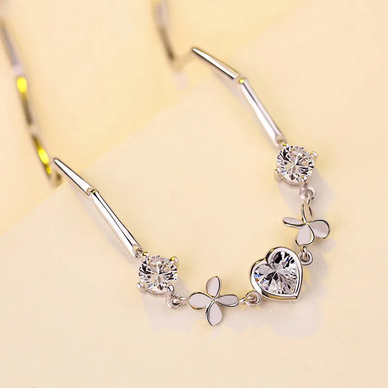 S925 sterling silver bracelet with heart-shaped four-leaf clover motif and extension chain