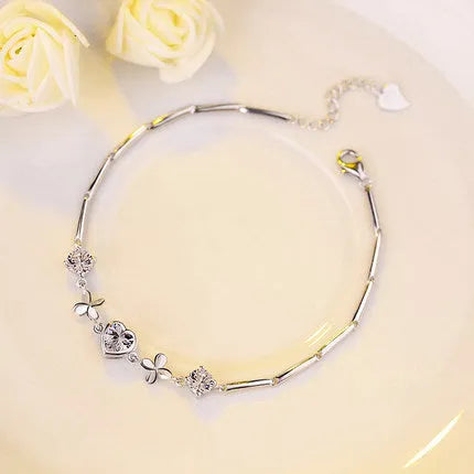 S925 sterling silver bracelet with heart-shaped four-leaf clover motif and extension chain