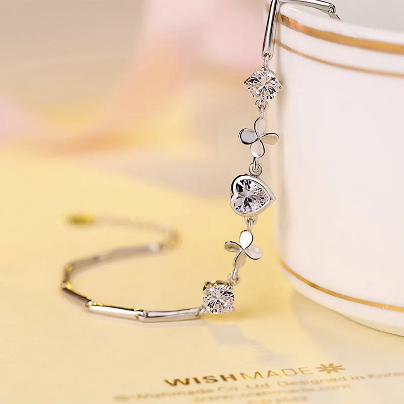 S925 sterling silver bracelet with heart-shaped four-leaf clover motif and extension chain