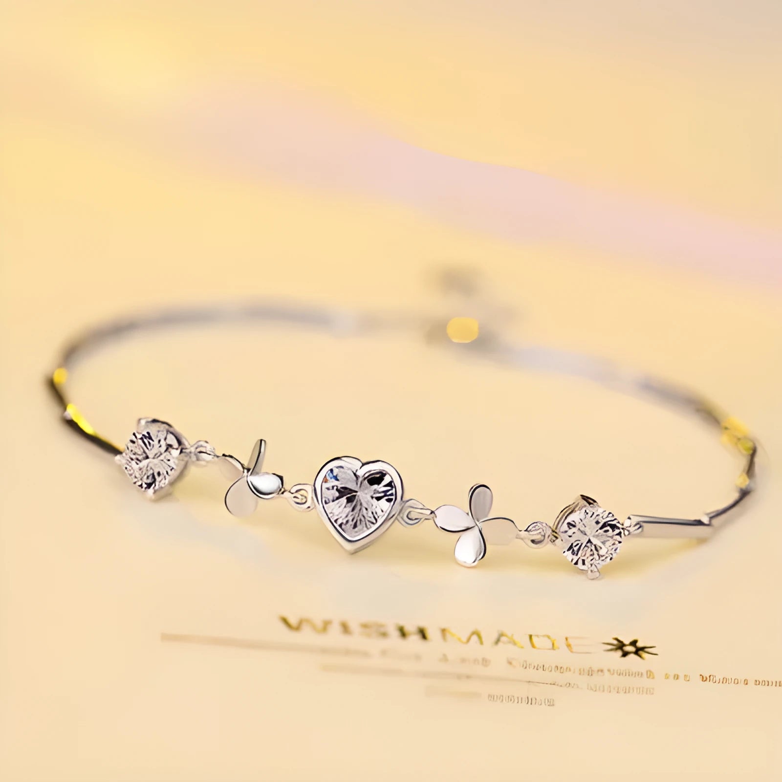 S925 sterling silver bracelet with heart-shaped four-leaf clover motif and extension chain