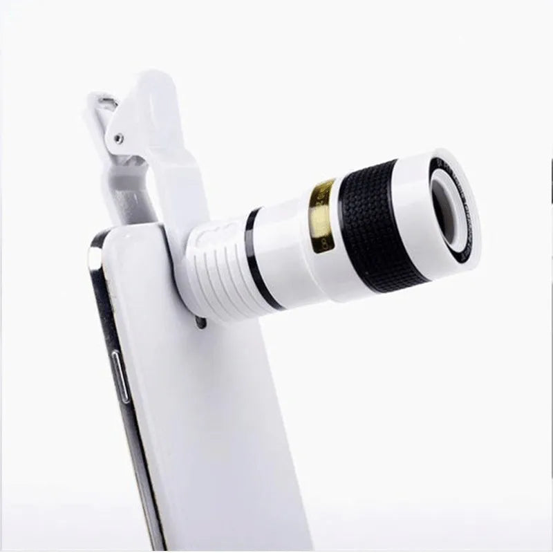 12X magnification phone telescope lens with adjustable mounting clip and cleaning cloth on a table.