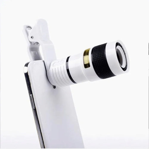 12X magnification phone telescope lens with adjustable mounting clip and cleaning cloth on a table.
