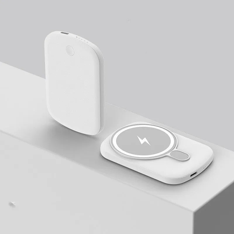 Slim Magsafe magnetic wireless power bank in Barbie Pink, shown next to an iPhone.