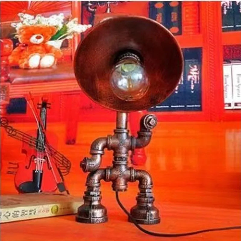 Industrial vintage table lamp constructed from iron water piping in a retro colour