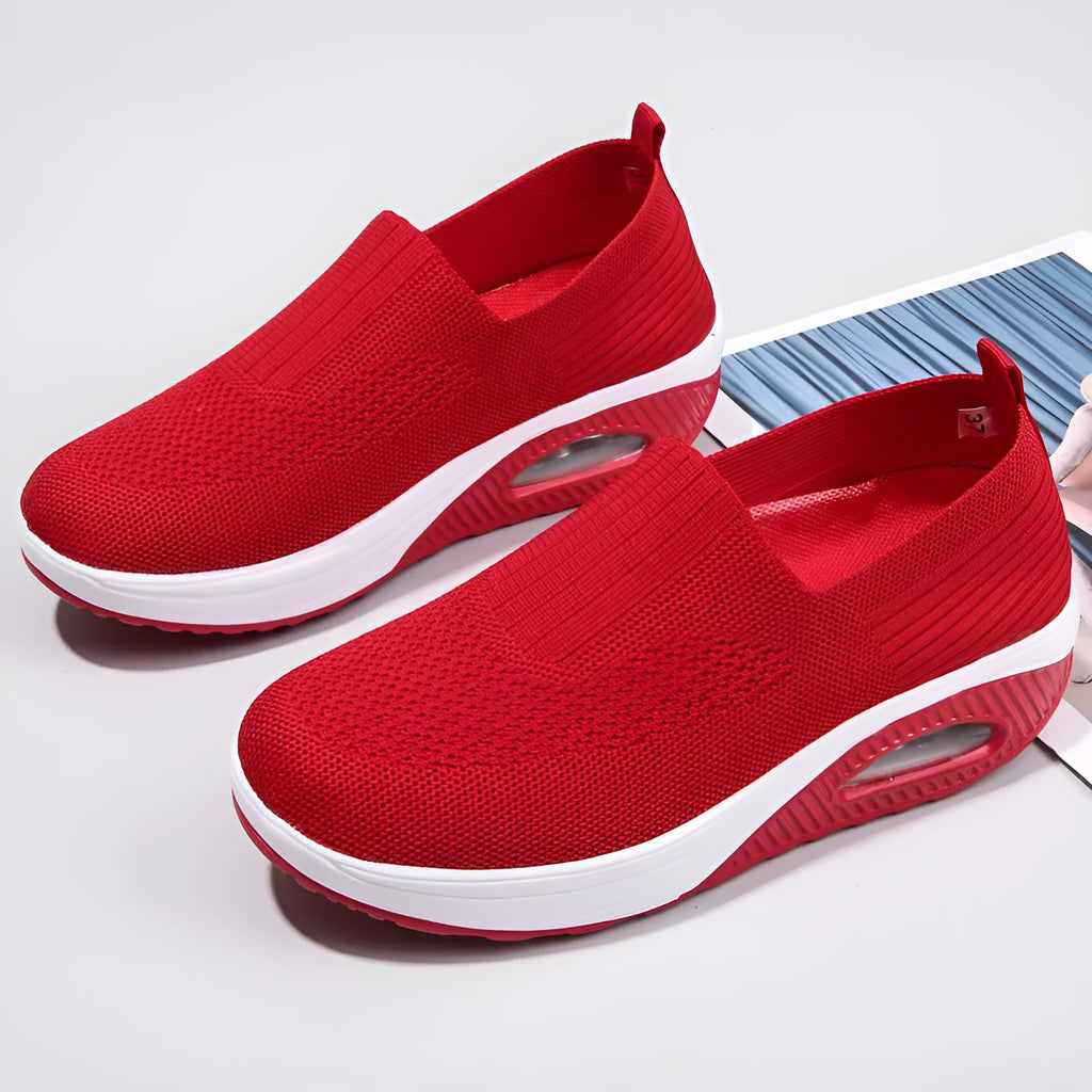 Women's mesh running shoes with air cushion midsole in beige colour on a white background.