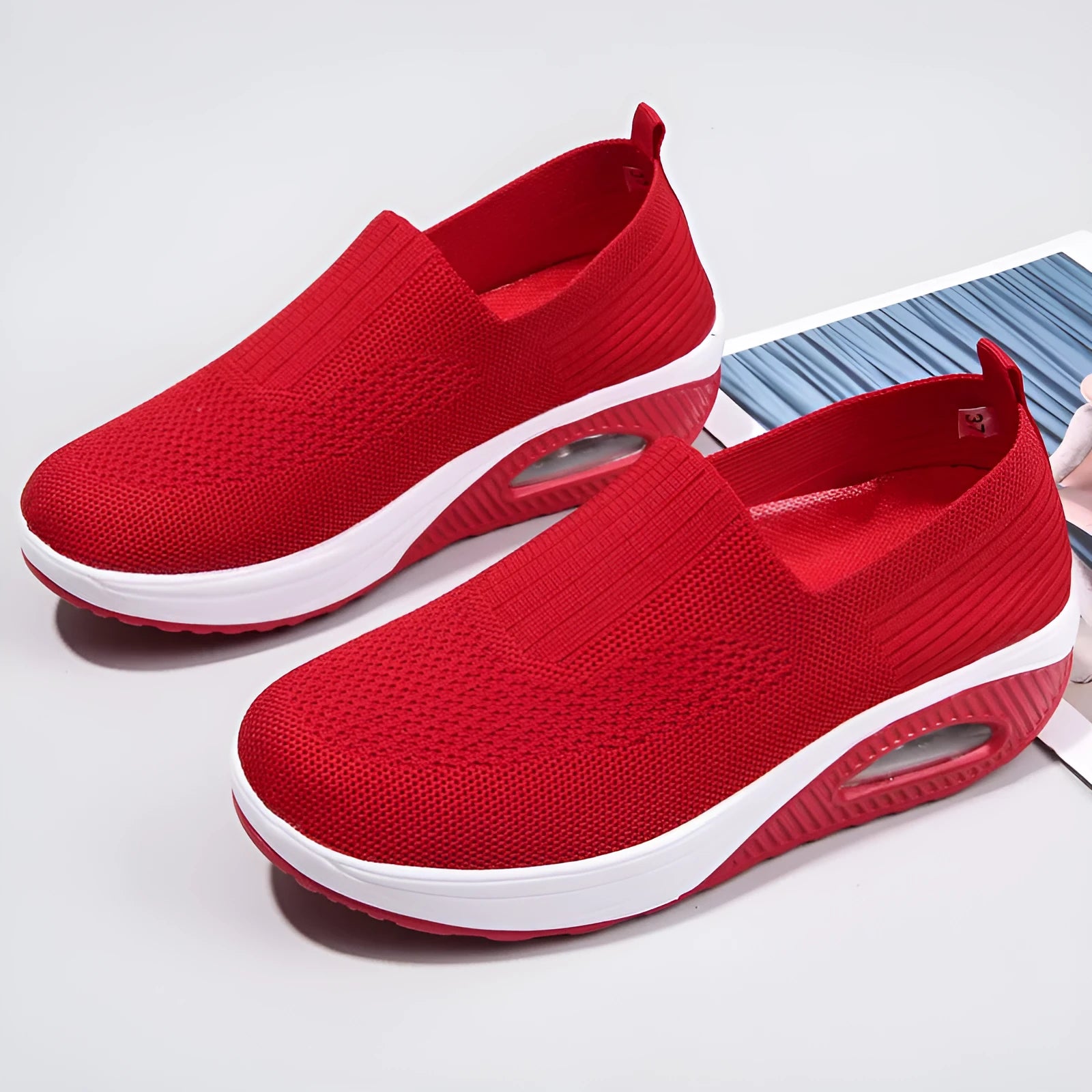 Women's mesh running shoes with air cushion midsole in beige colour on a white background.