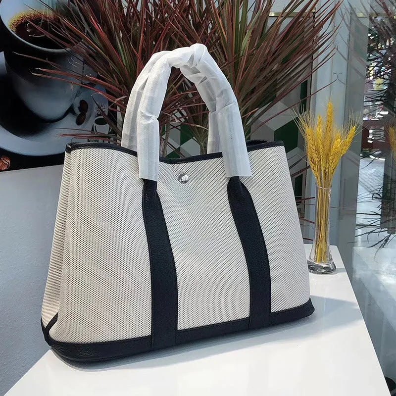 Genuine leather women's crossbody tote bag with canvas lining in bucket shape