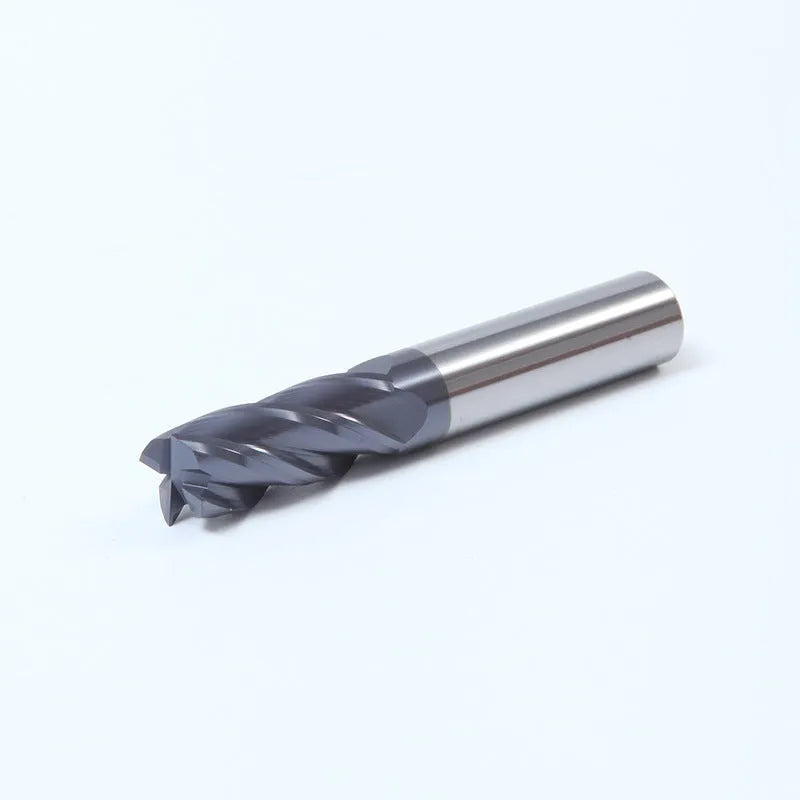 Carbide milling cutter with straight shank and spiral cutting edge on a dark background.