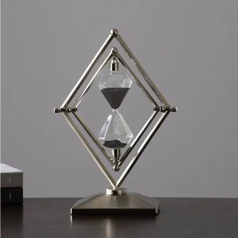 Metal-framed glass hourglass sand timer in bronze or silver with white or black sand