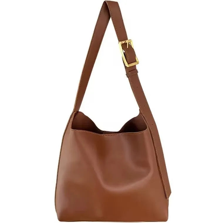 Two women's soft PU shoulder bags with swing threads, one black and one brown, showing structured design.