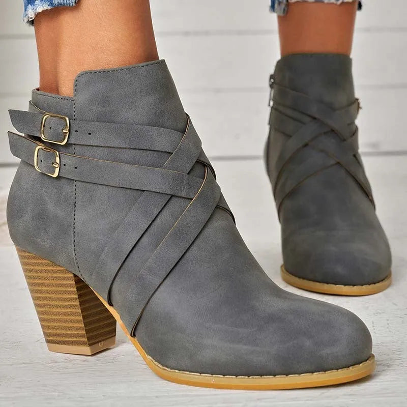 Plus size black short boots with a side zipper, buckle, and a 7cm stout heel on a rubber sole.