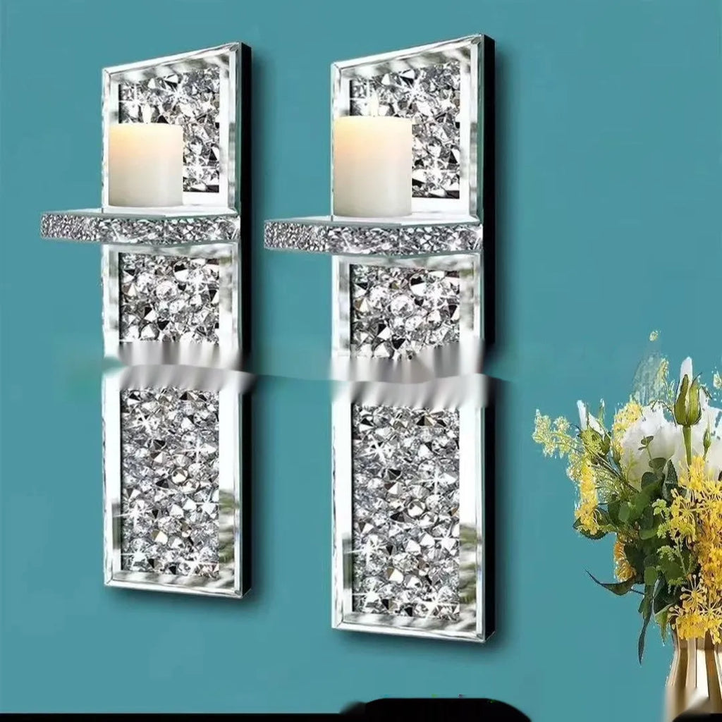 Pair of silver mirror glass wall hanging candle holders measuring 38cm tall.