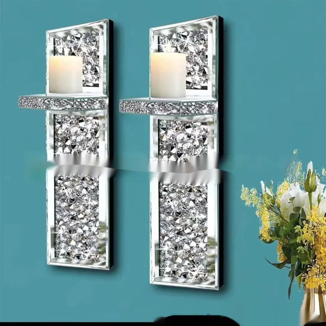 Pair of silver mirror glass wall hanging candle holders measuring 38cm tall.