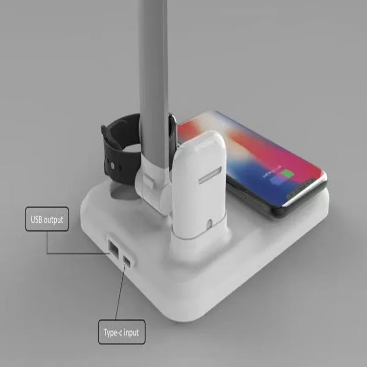 Black and white 4-in-1 LED desk lamp with integrated wireless charging pad.