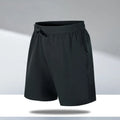 Man wearing loose black quick-dry sports shorts with an elastic waistband