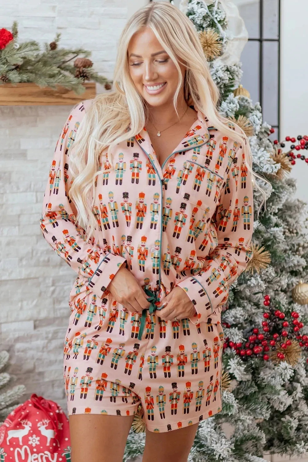 Pink polyester women's long-sleeved pajama short suit with casual printed design on white background