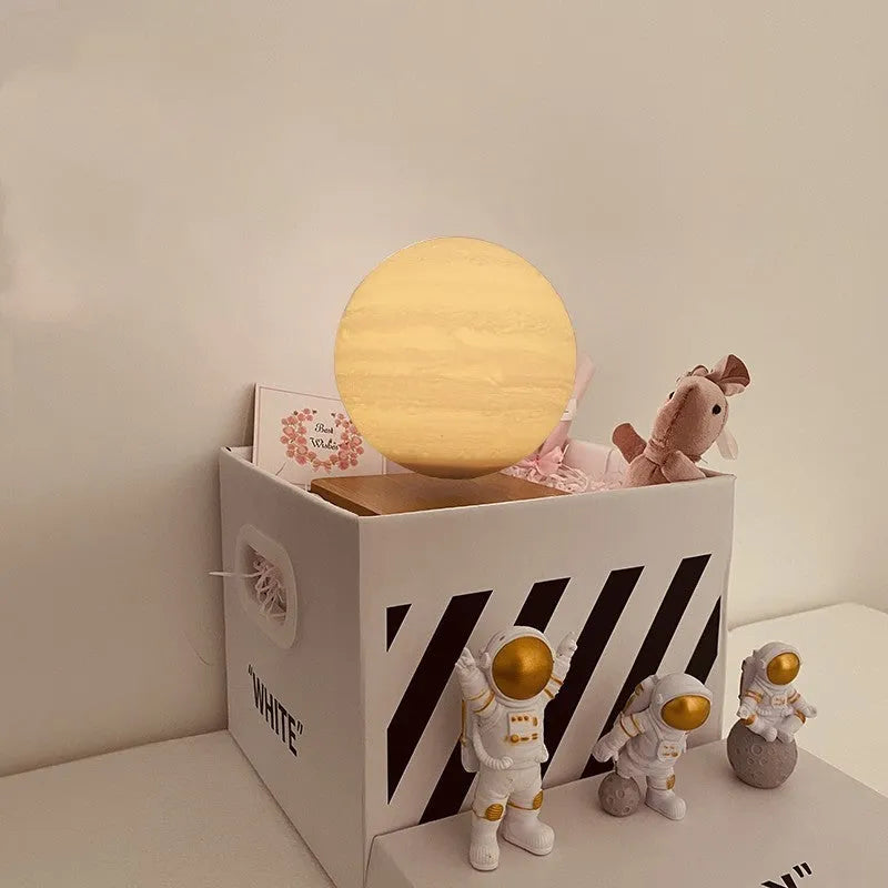 Maglev levitating planet night light floating above base with astronaut figurines
