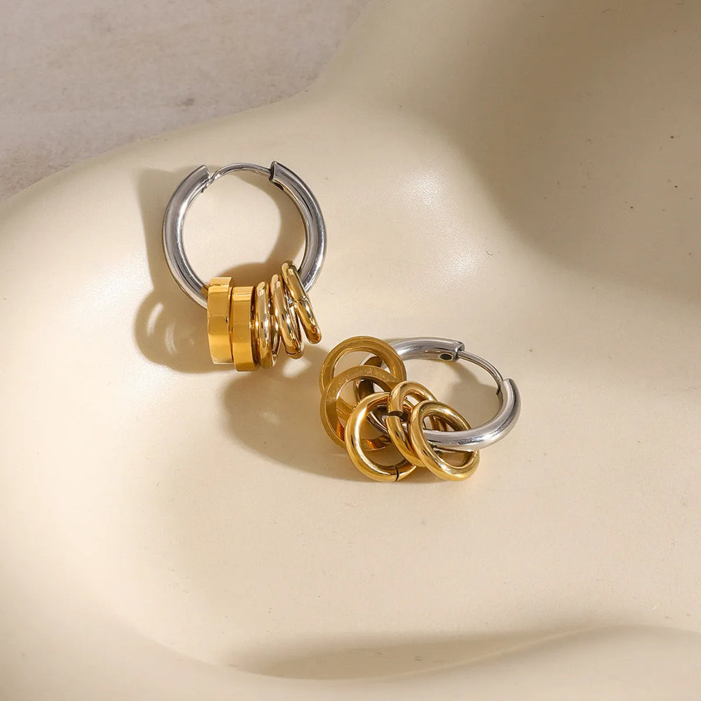 A pair of stainless steel electroplated earrings with a colour matching finish in a simple ins style.