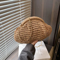 Shell-shaped women's straw bag with chain strap in khaki colour option showing zippered pocket detail