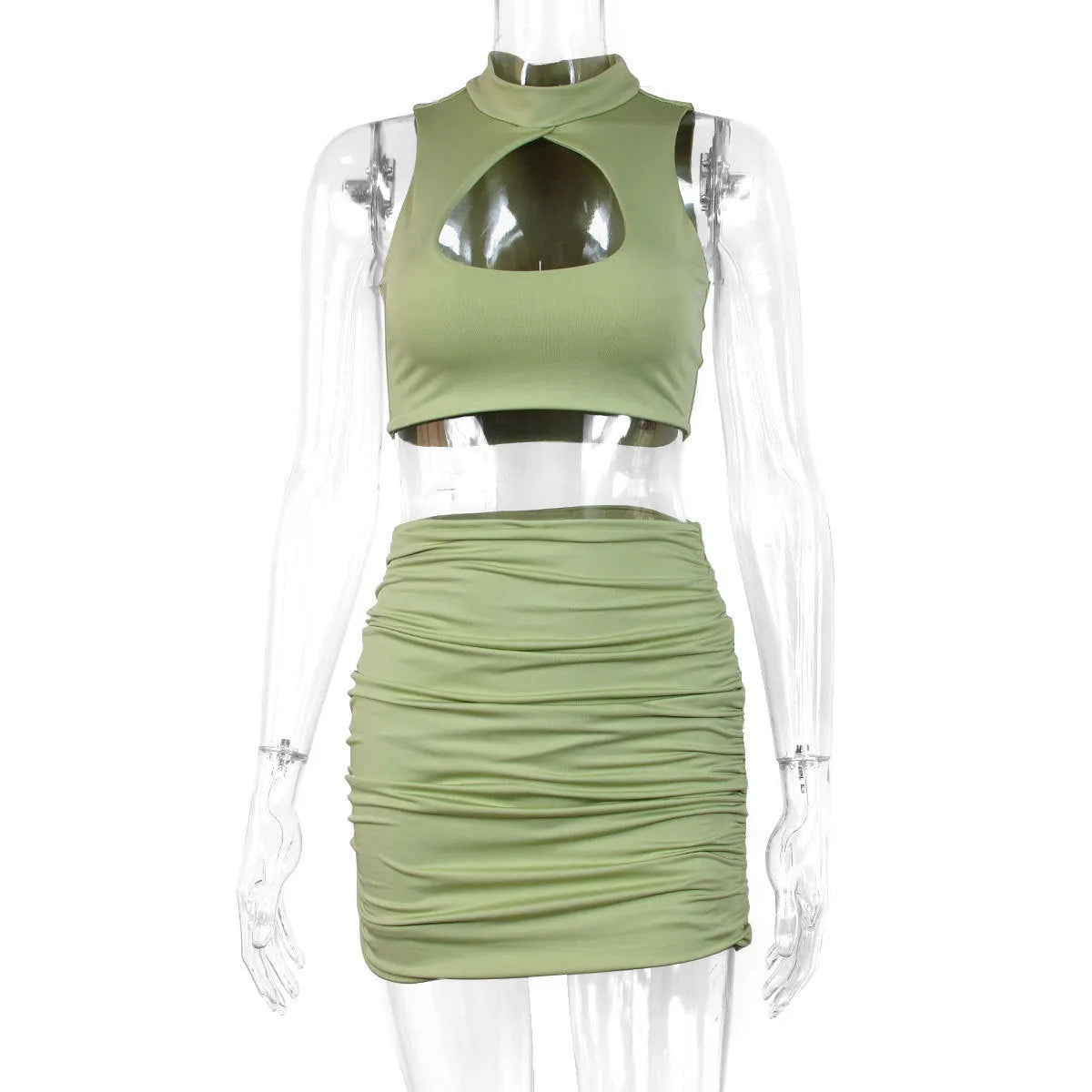Light purple women's two-piece set with hollow-out vest and split skirt on a model.