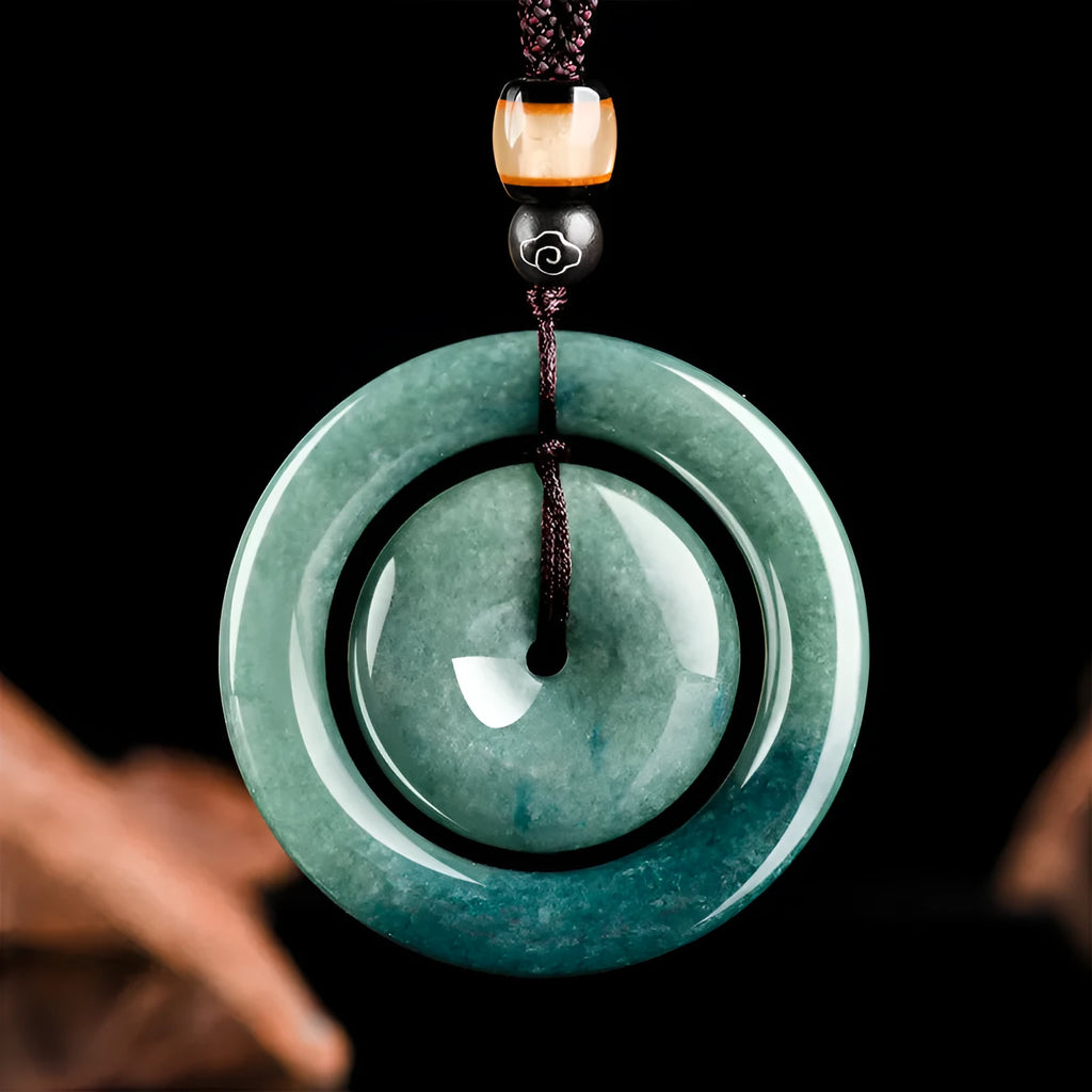 Emerald green carved jade pendant on necklace 21g