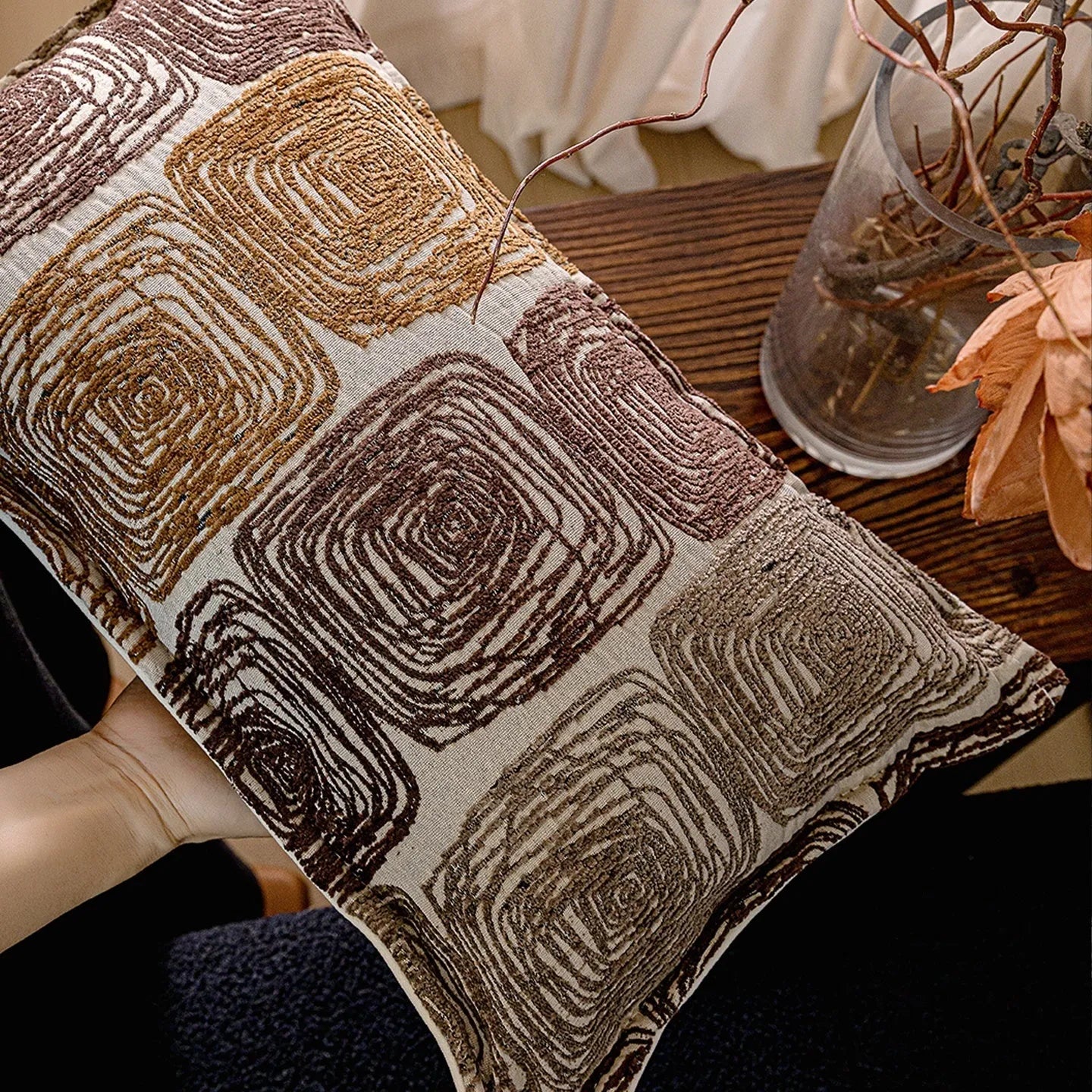 Square cushion cover with abstract coil pattern in cream and coffee colours for sofa decoration