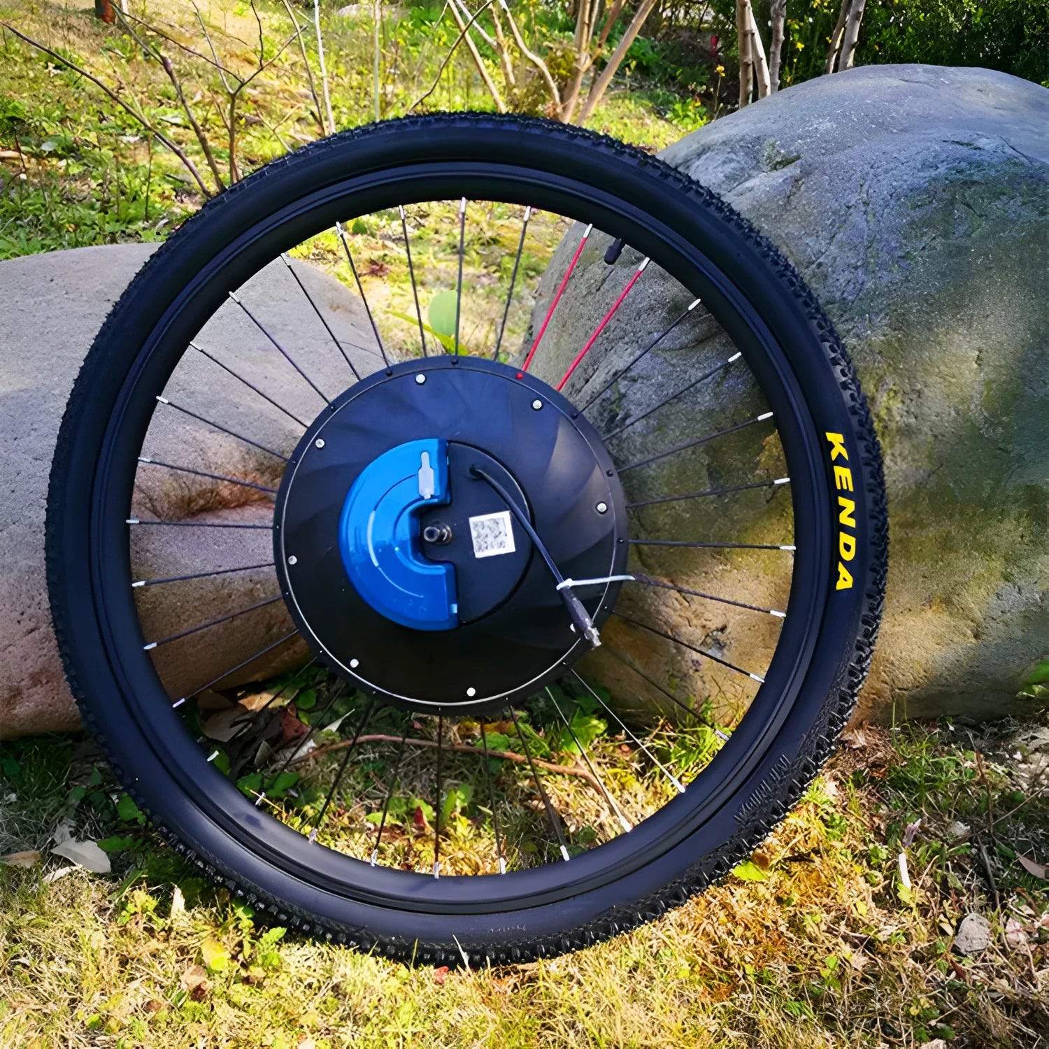 26-inch bicycle electric conversion kit showing alloy hub motor, lithium battery pack, and charger with plug options.