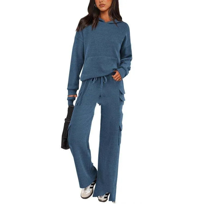 Women's two-piece polyester leisure suit in a solid colour, showing long sleeves and full-length trousers.